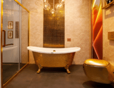 Gold freestanding bathtub in a luxury bathroom – bathroom product photography