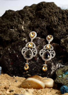 Diamond drop earrings on dark soil – jewellery product photography