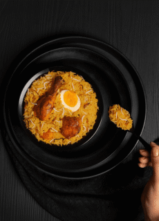 Dish of biryani in a black bowl – food photography