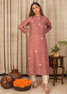Woman in coral embroidered kurta – ethnic wear photoshoot