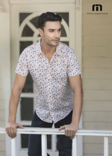 Male model in printed shirt on a porch – menswear brand catalogue