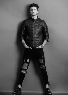Male model in black leather jacket – black and white fashion portrait