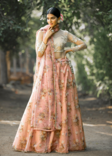 Model in peach embroidered lehenga – bridal wear photoshoot