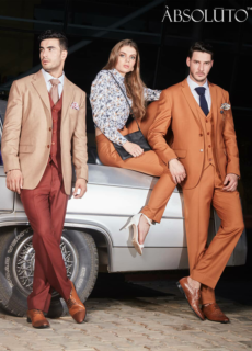 Models in beige and orange suits with a vintage car – menswear campaign