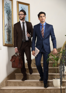 Two male models in suits on a staircase – menswear brand campaign