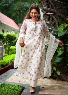 Woman in white printed kurta set in a garden – ethnic wear photoshoot