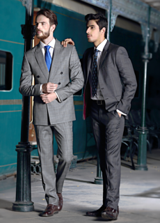 Two male models in suits on a railway platform – menswear editorial