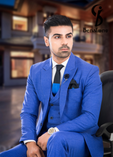 Male model in blue suit seated – menswear brand campaign