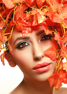 Model with orange flower headdress – creative beauty photoshoot