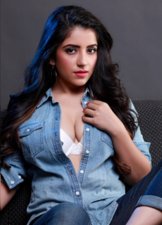 Model in denim shirt with blue-streaked hair – fashion portrait
