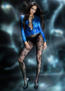 Model in blue satin blouse and patterned tights, full length – glamour shoot