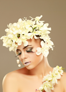 Model with white flower headdress – creative beauty photoshoot
