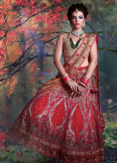 Model in red bridal lehenga among autumn trees – bridal fashion shoot