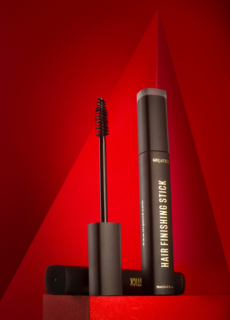 Mascara tubes on red backdrop – cosmetics product photography